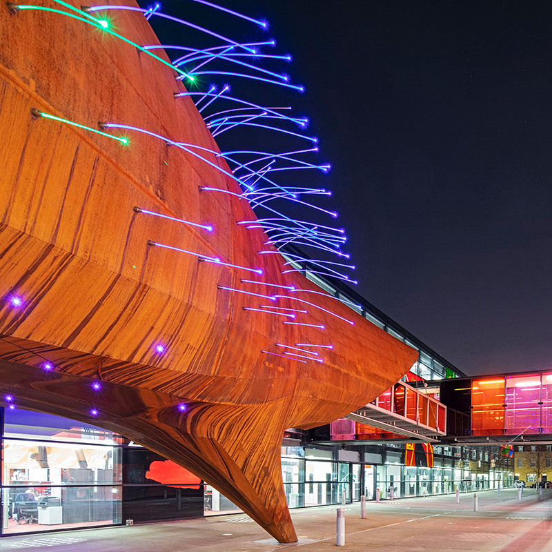 Neuron Pod illuminated at night, outside the Blizard Building in Whitechapel
