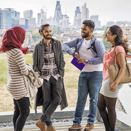 Group of students standing and talking together